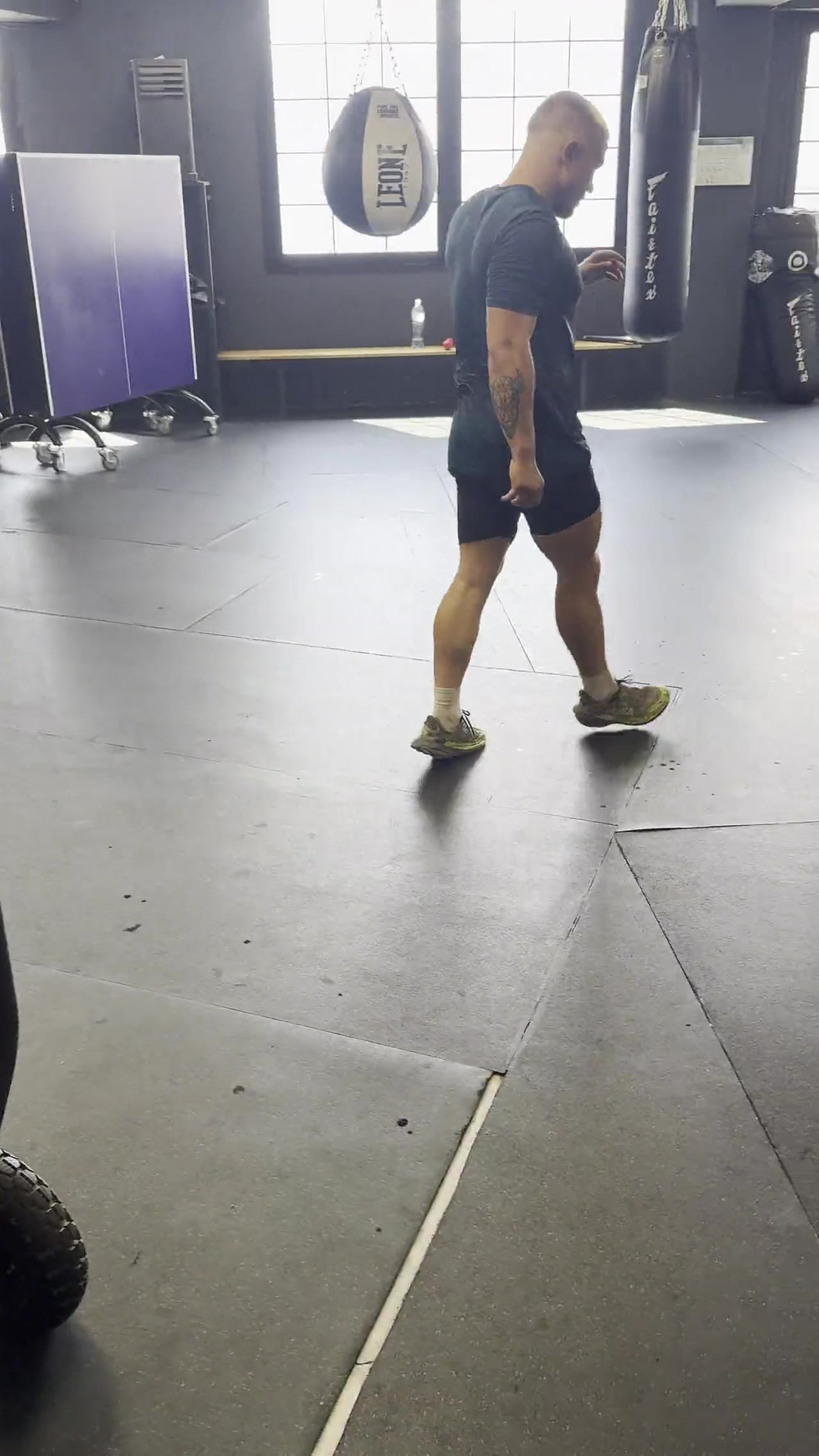 Archive video of heavy bag work in the boxing area